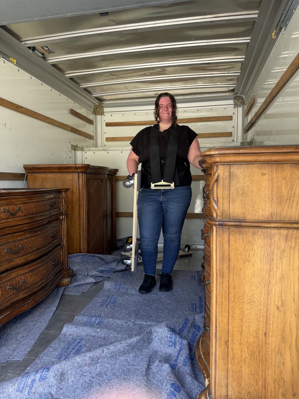 OverKnight team member Addie with furniture loaded in the truck on a Gainesville cleanout job